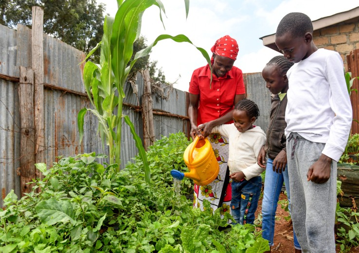 Belinda with her children in garden