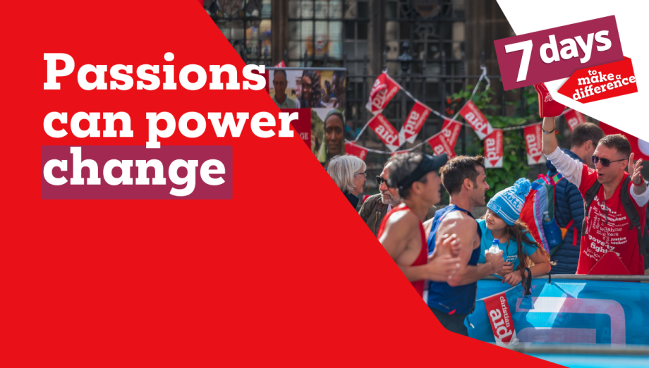 A crowd of Christian Aid supporters cheer for runners as they pass buy, dressed in red Christian Aid shirts and holding foam hands. the copy reads 'Passions can power change'.