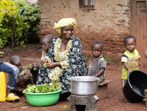 Woman eating with children 