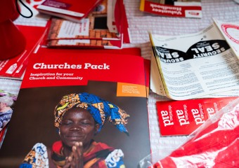 A table full of Christian Aid Week resources