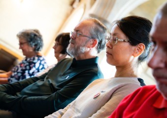 Supporters praying in a church